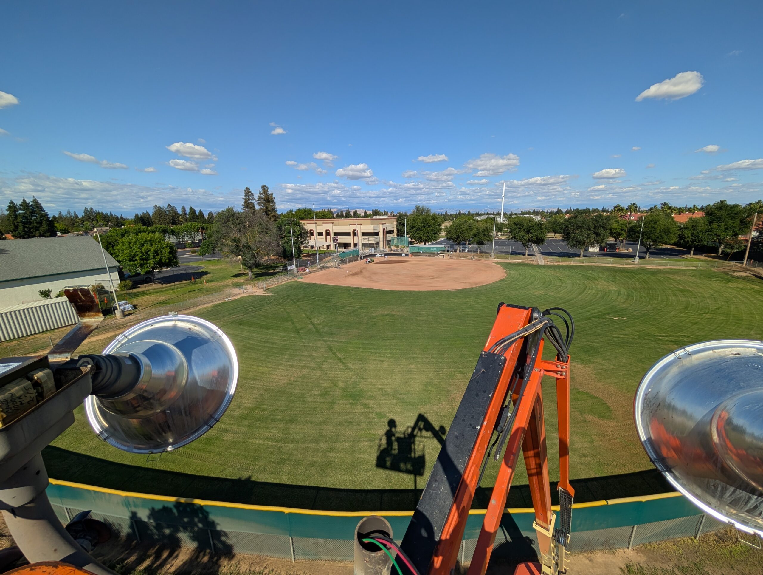 Looking down from sports light pole at baseball infield — Reliant Electrical Fresno