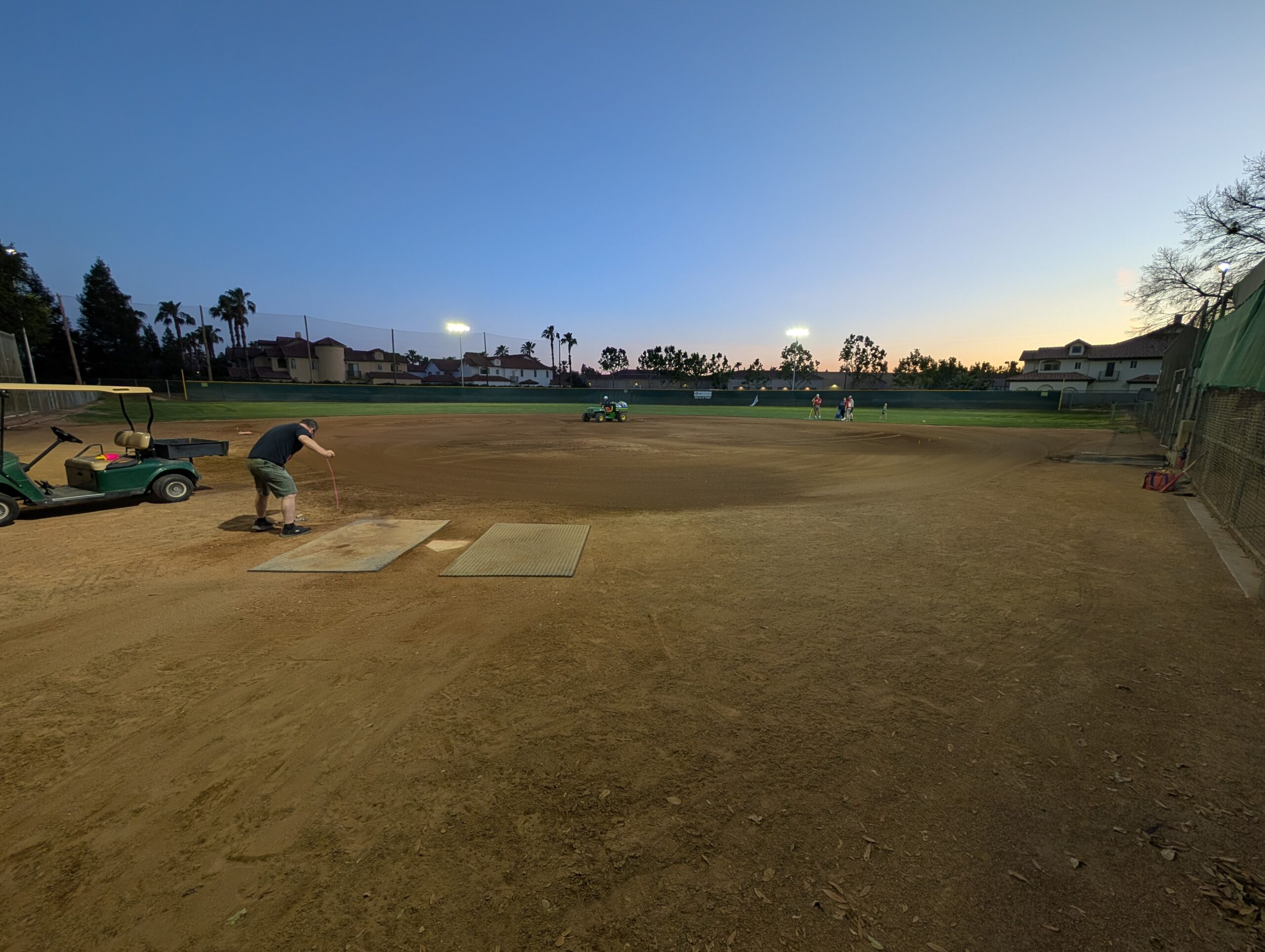 New LED sports lights on Bethany Church baseball field at dusk