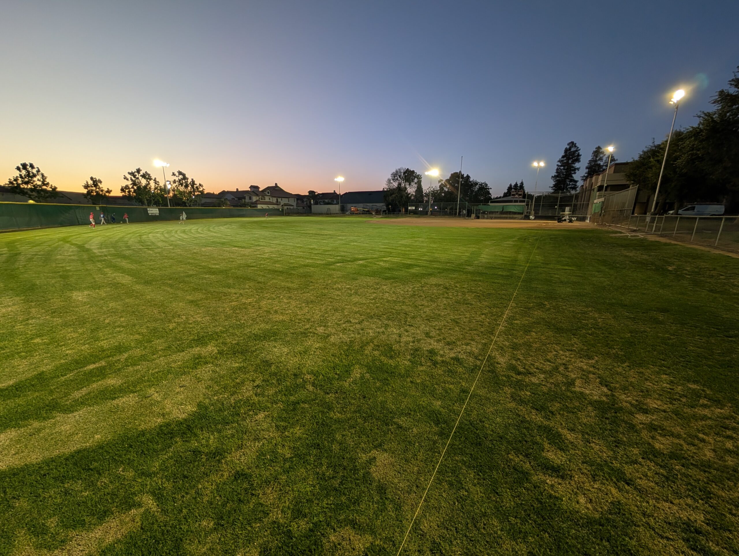 Bethany Church baseball field illuminated by new LED lights at twilight